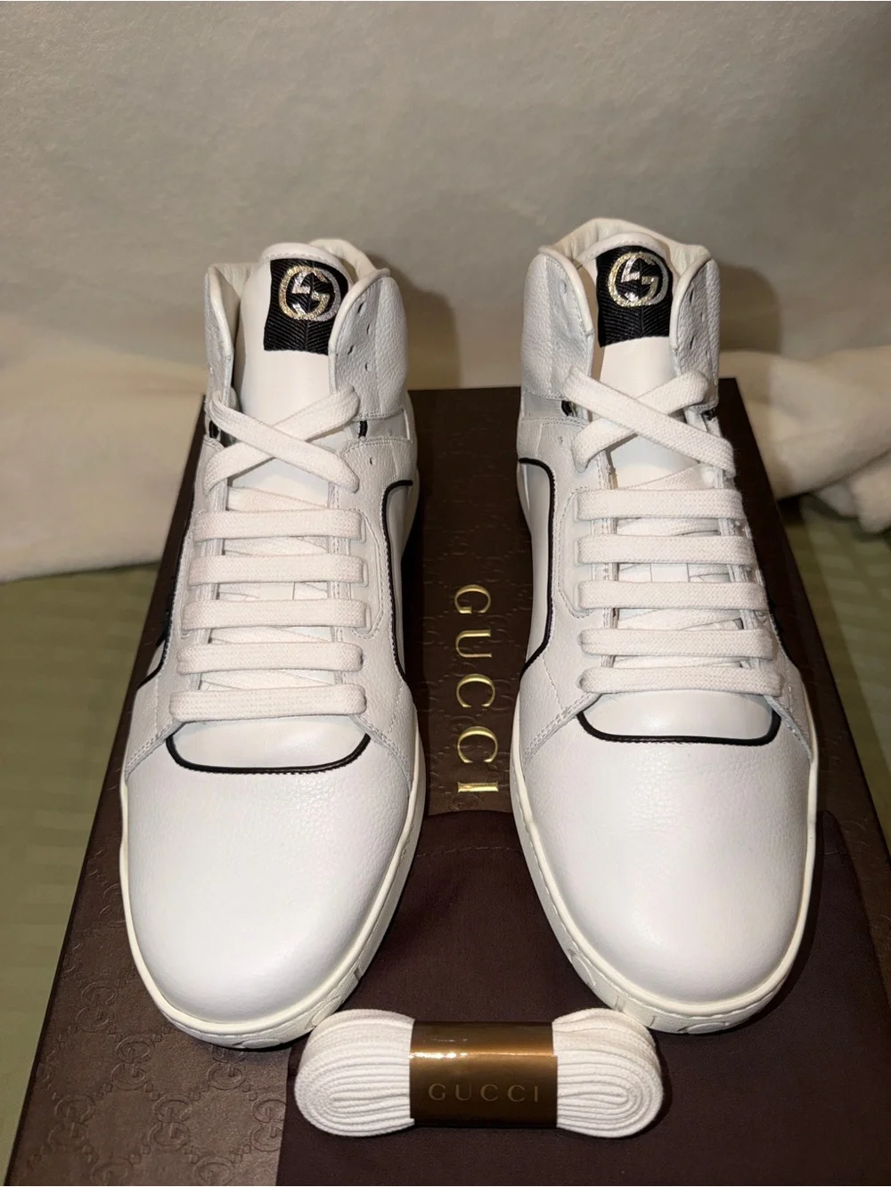 Gucci White Leather Low-Top Sneakers with Red Logo Sole.